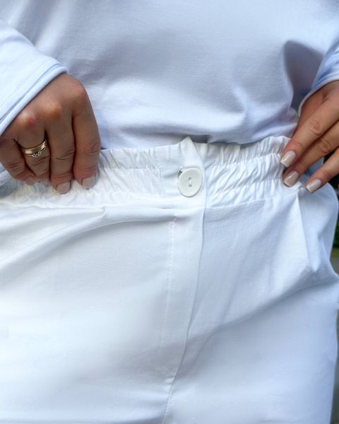 Жіночі брюки карго колір білий р.42/44 440156 440160 фото
